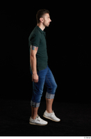  Trent  1 blue jeans casual dressed green t shirt side view walking white sneakers whole body 0003.jpg